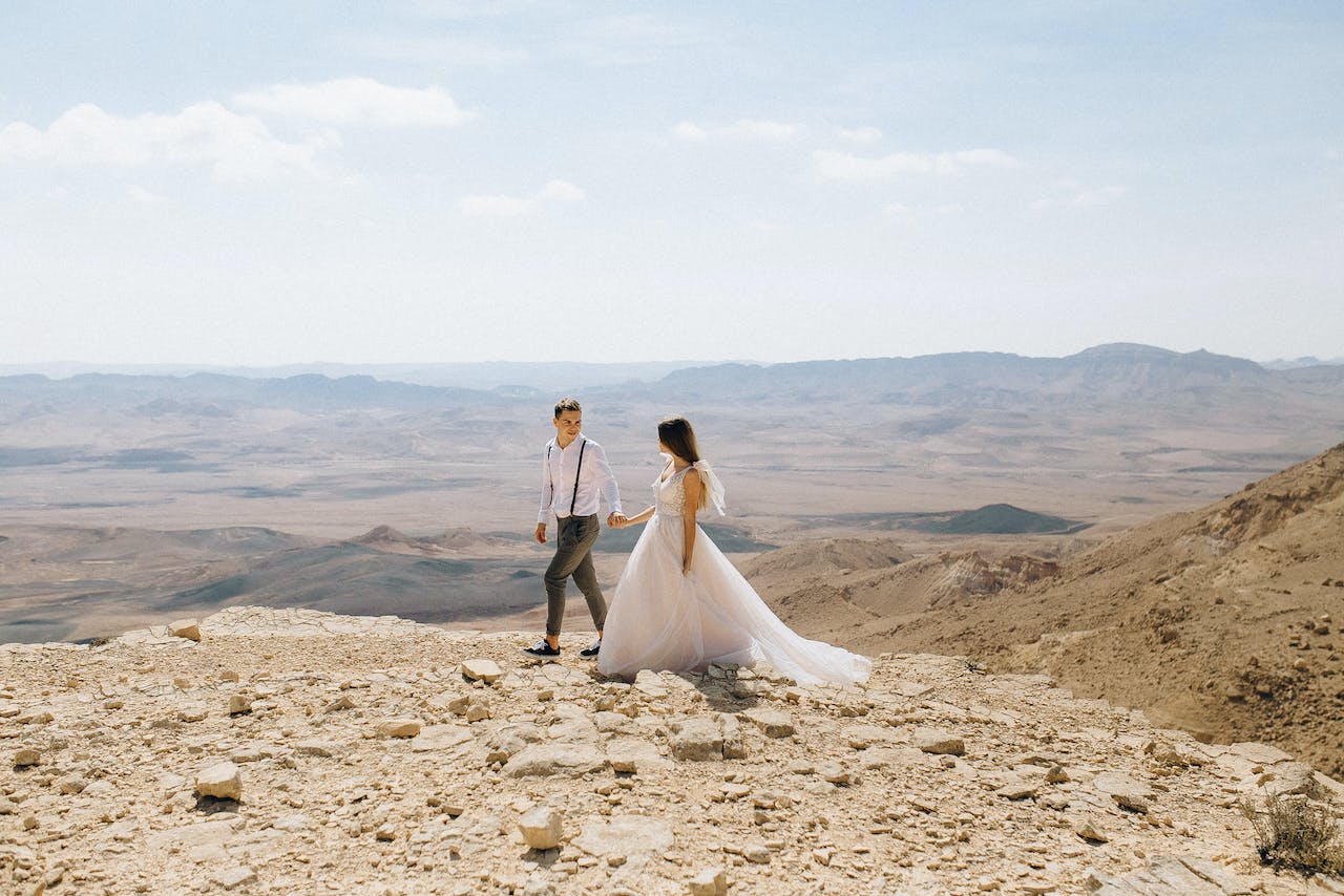 Bride and Groom Walking in the Desert
