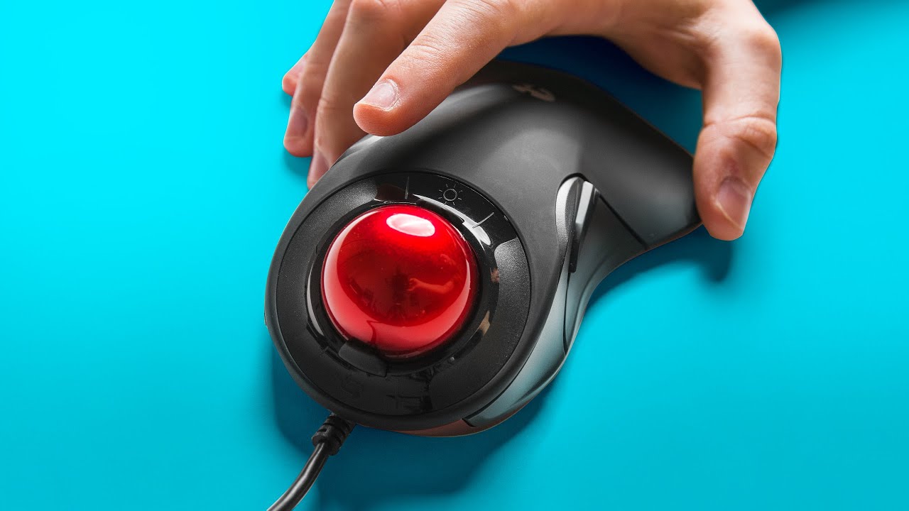 A hand holding a Gaming Trackball Mouse