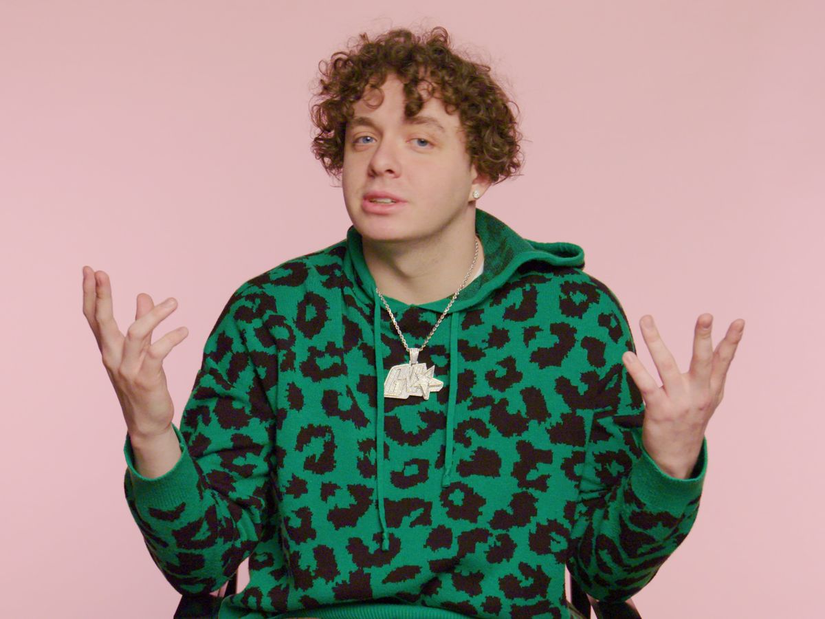 Jack Harlow wearing a green and black jacket