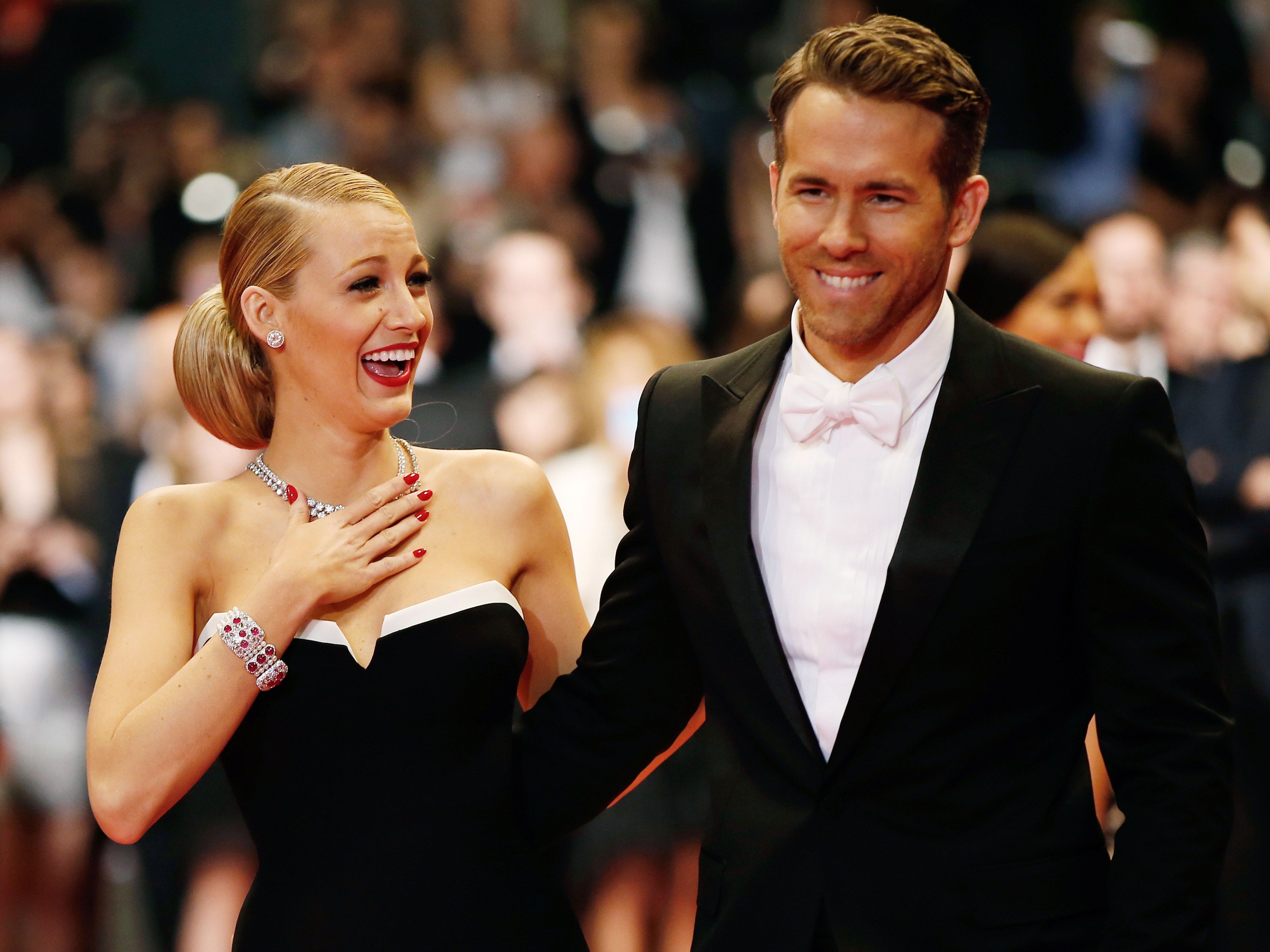 Blake Lively wearing a black dress and Ryan Reynolds wearing a black suit