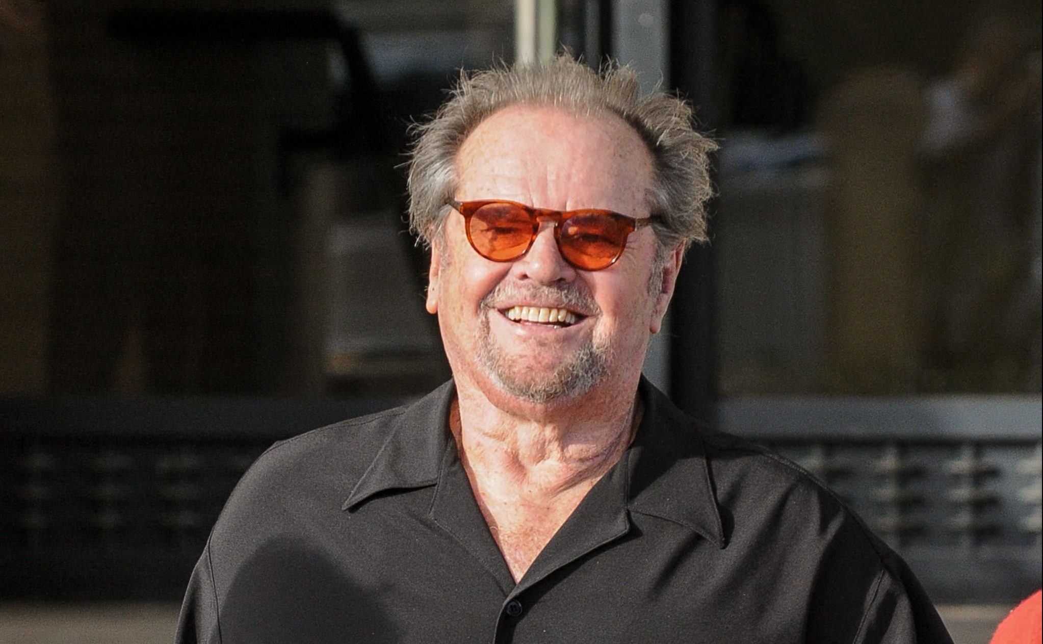 Jack Nicholson wearing a black polo