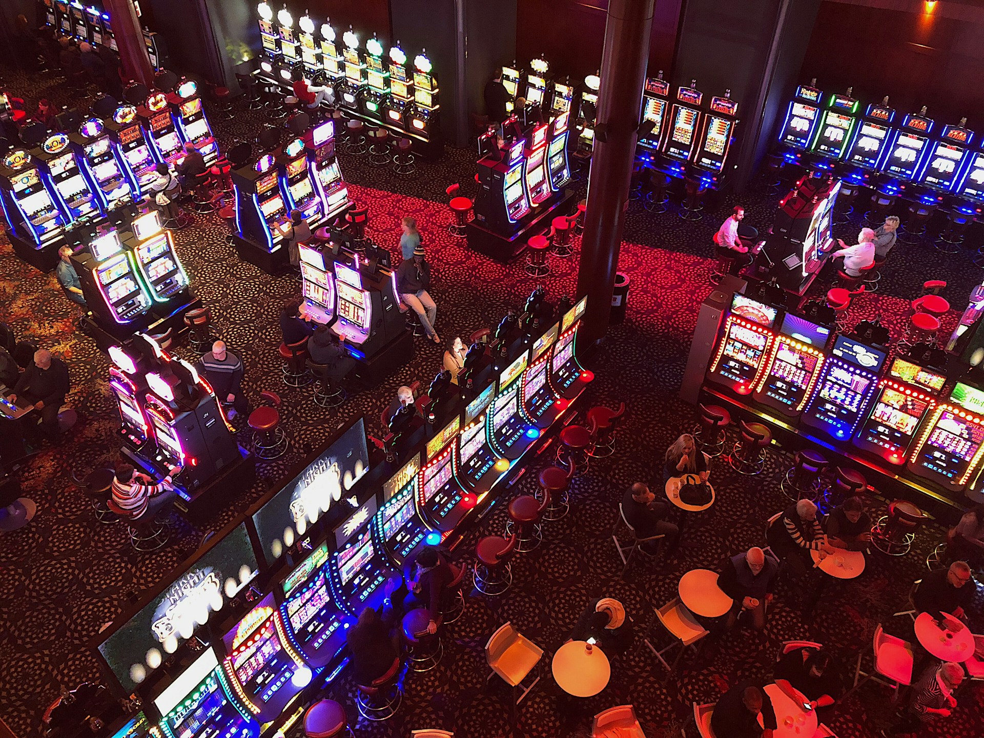 An aerial view of a casino floor with several slot machines