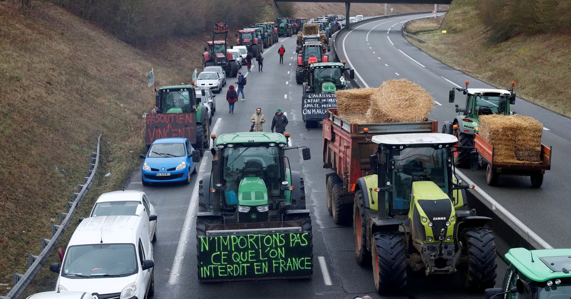 French farmers driving their tractors on the road during the protest