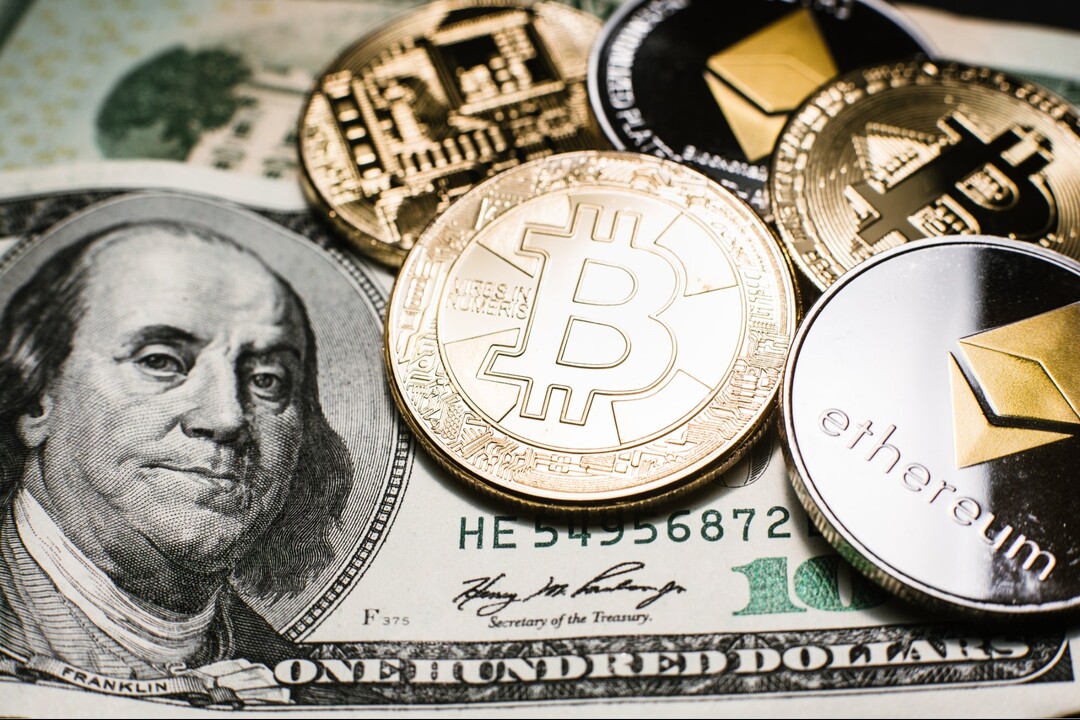 Bitcoins on dollar bills