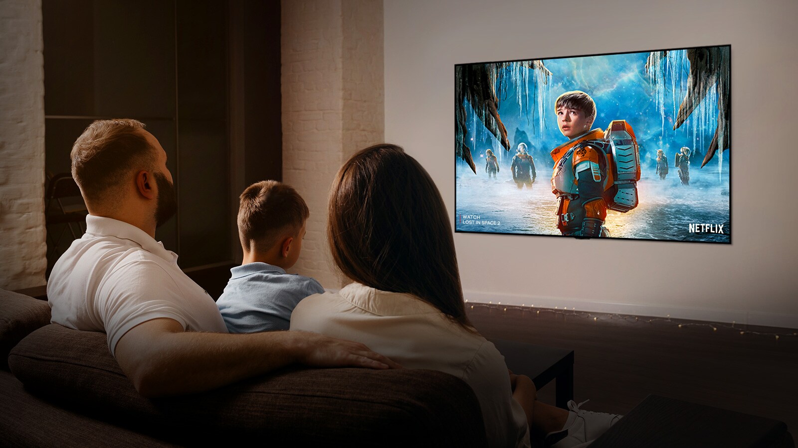 A family watching a movie on a 4K Ultra HD television