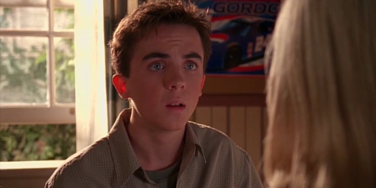 Frankie Muniz on a brown shirt acting surprised while staring at a girl 
