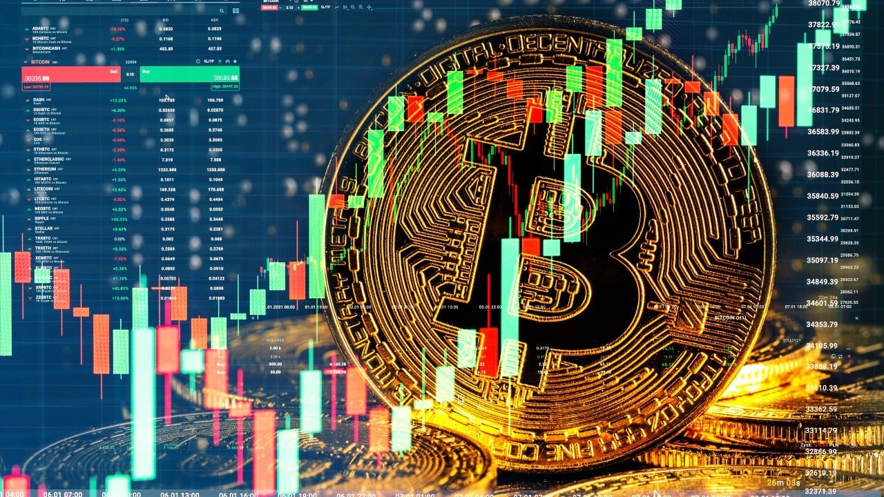 Bitcoin next to a trading chart digital screen