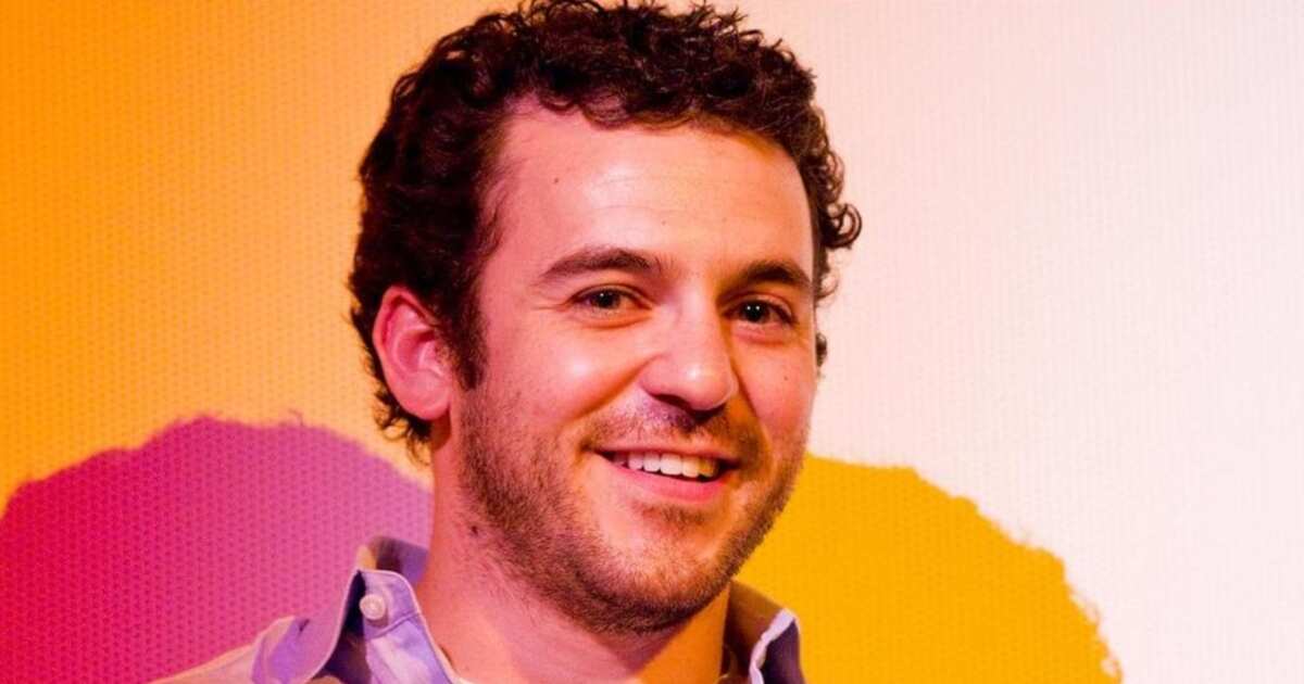 Fred Savage smiling at an event