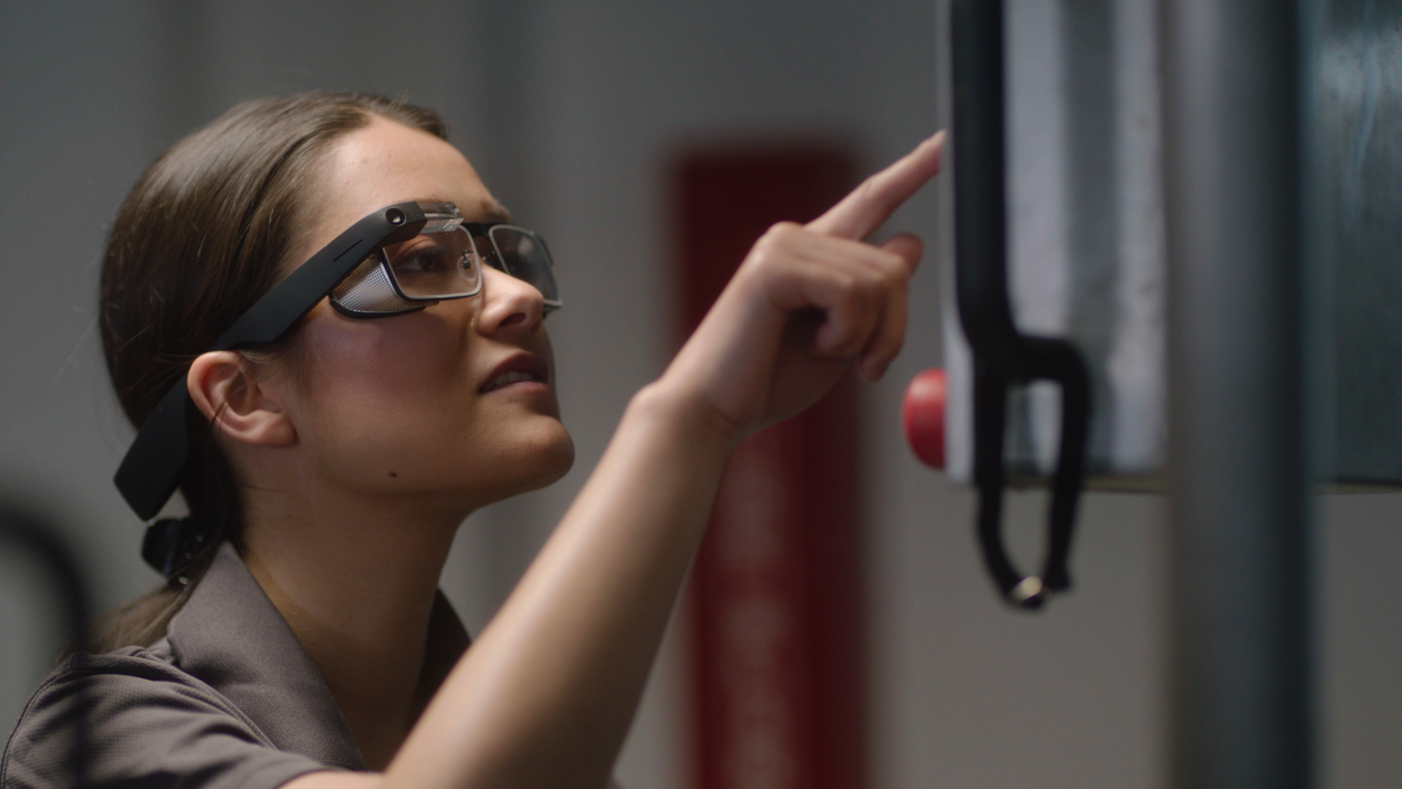 A woman wearing the Google Glass Edition 2 smart glasses