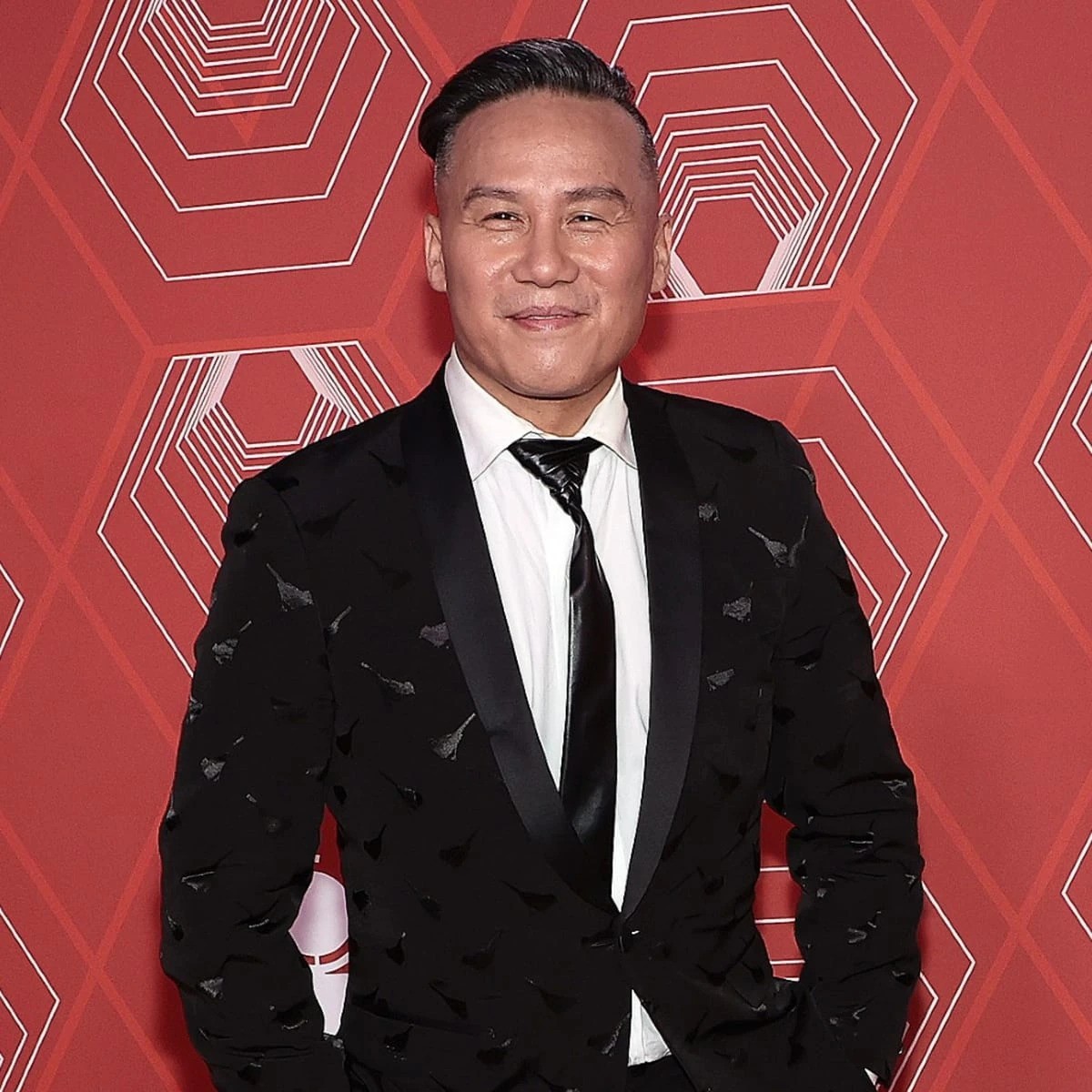 BD Wong wearing a black suit at an event