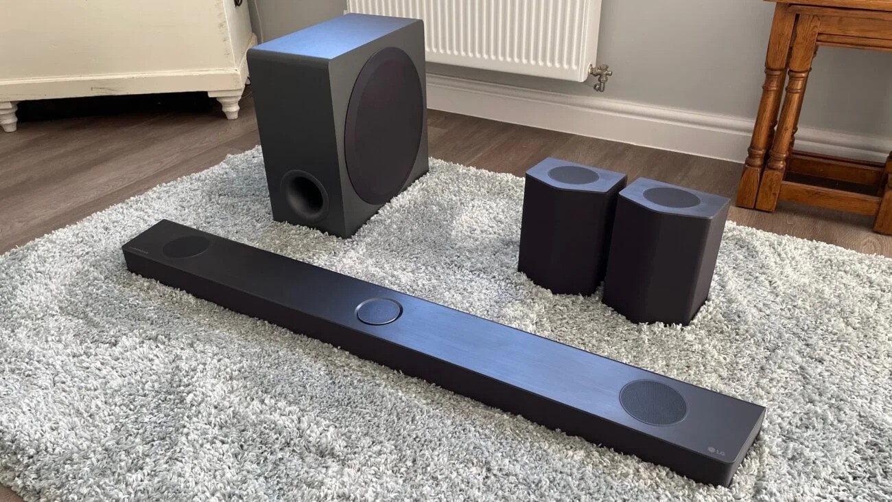 LG Soundbar S95QR home theater system placed on a rug