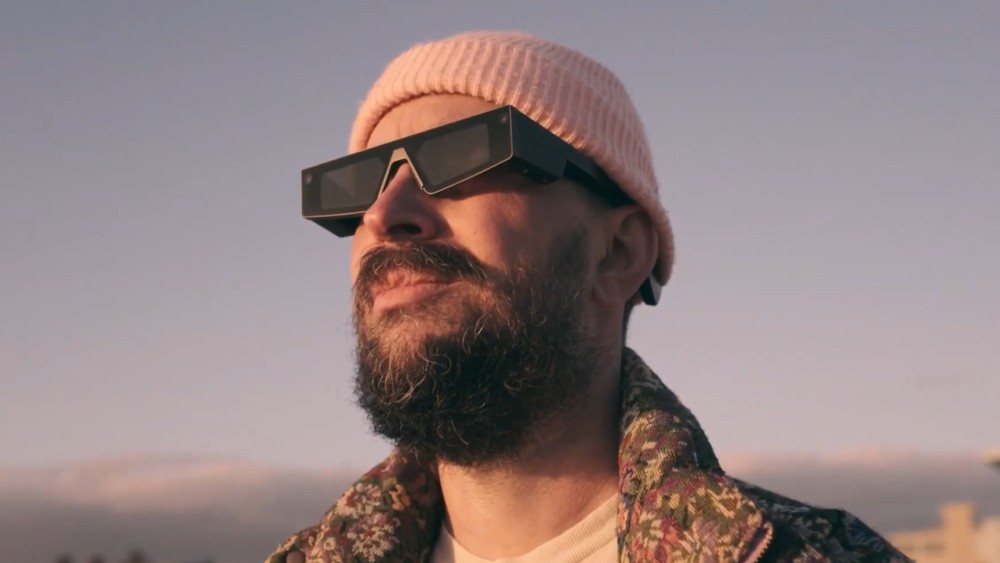 A man wearing the Spectacles smart glasses by Snap