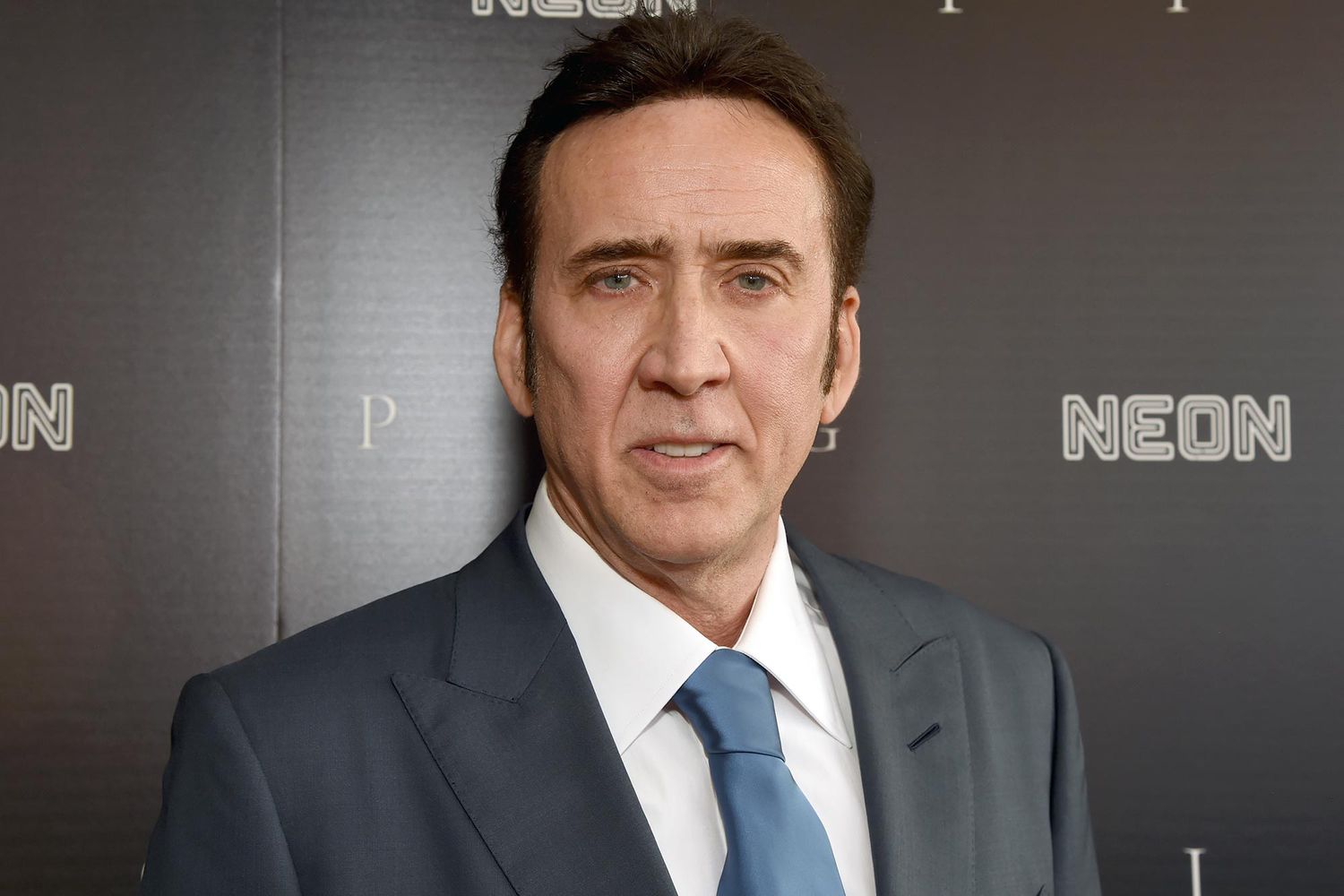 Nicolas Cage wearing a gray suit